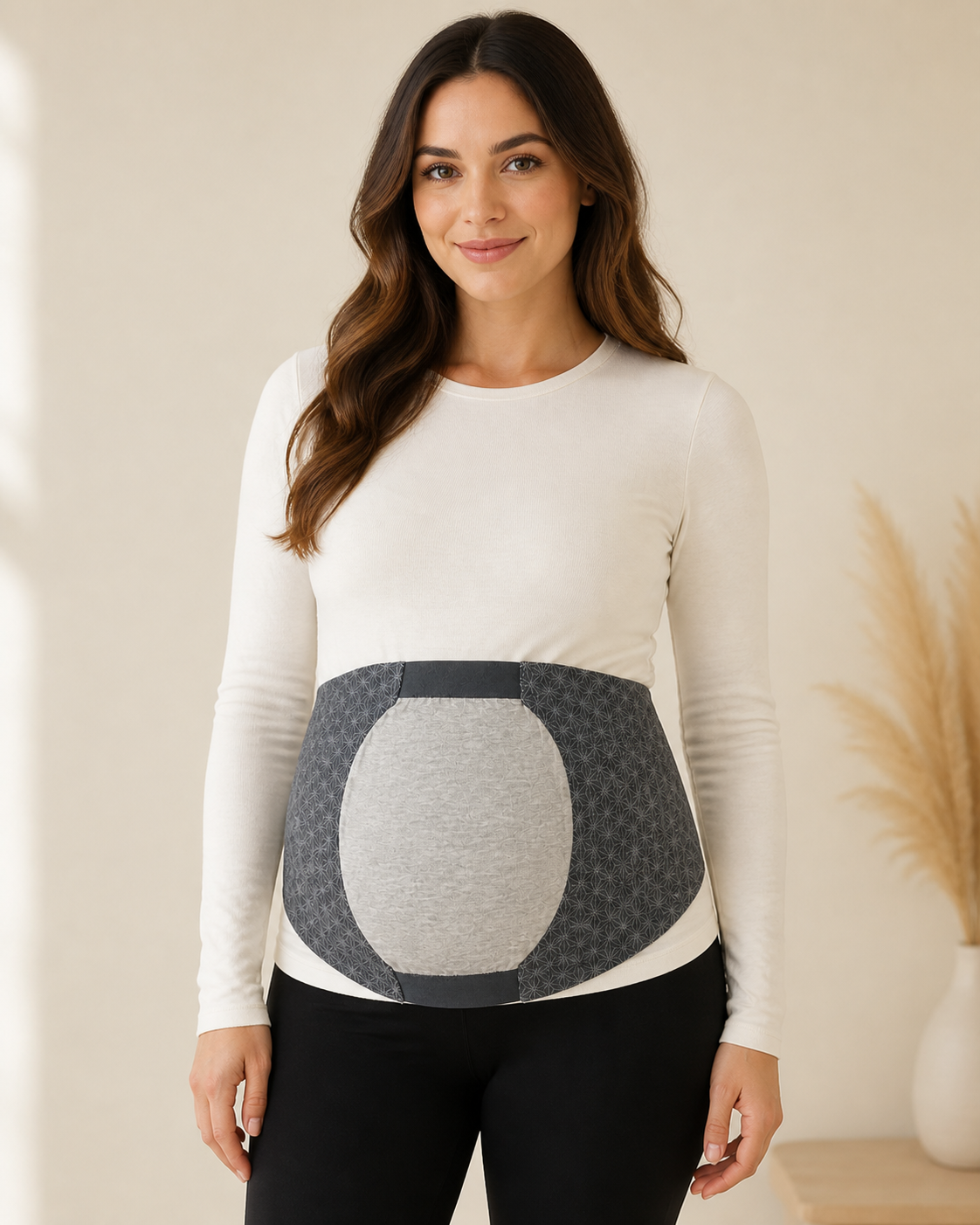 Front view of woman wearing grey maternity belly support band